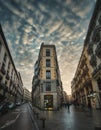 Madrid streets with people wet streets shops Royalty Free Stock Photo