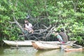 Madu Ganga, Balapitiya, Sri Lanka - DECEMBER 2015 - Two fishermen relaxing in the mangrooves during a working break