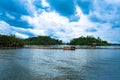 Madu River Safari, beautiful tropical riverbank. fish farm fence.