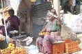 Women buying and selling fruit