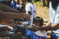 MAE HAE NOI OMKOI CHIANG MAI, THAILAND - JANUARY 10 , 2019 : Volunteers donate lunch to the children in Chiang Mai, Thailand