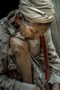 Refugee people, Old refugee woman in temporary shelter at refugee camp in Thailand, Selective focus