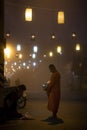 Maehongsorn thailand - jan22,2017 : thai buddhist monk receiving food from people on foggy street in maehongsorn northern of