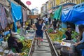 MAEKLONG, THAILAND-DECEMBER 11,2016 : The famous railway market or folding umbrella market at Maeklong, Thailand, A famous market