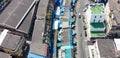 Maeklong, Thailand, panoramic downward aerial view of city buildings and famous railway market