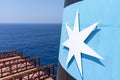 Maersk Line logo on the funnel of the container ship.