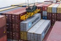 Maersk owned container loaded by the gantry crane on the container ship.