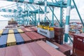 Maersk owned container loaded by the gantry crane on the container ship.