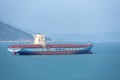 Maersk owned container ship at anchor outside the port area.