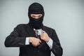 Mafioso in suit pulls out a gun before the bank robbery work Royalty Free Stock Photo