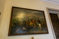 Large painting depicting a horse battle