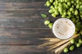 Mag with beer, spikelets and hop on wooden table Royalty Free Stock Photo