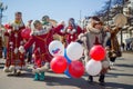 Children in traditional clothes of indigenous peoples of Siberia and the Russian Far East dance on the city street.