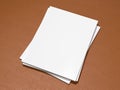 Magazine cover with blank white page mockup on leather substrate Royalty Free Stock Photo