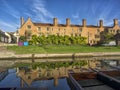 Magdalene College building and refection seen across the River Cam