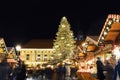 Magdeburg, Germany - December 11,2022: Beautiful traditional German Christmas Market square in city center many carousel Royalty Free Stock Photo