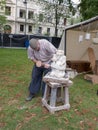 Magdeburg, Germany - 29.08.2014: Kaiser-Otto-Fest. Reconstruction of historical events of the city. Stonemason makes a figure of