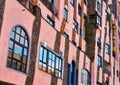 Windows and columns at the front of the green citadel, a residential building, commercial building and hotel by artist