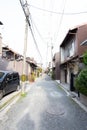 Mage of an empty street lined with residential houses