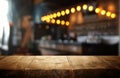 Mage of wooden table in front of abstract blurred restaurant lights background