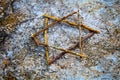 Magen David from tree branches on the ground in memory of the victims Jews during the Holocaust