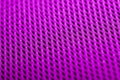 Magenta background. Mesh fabric texture. Macro