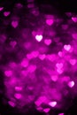 Magenta color heart bokeh background photo. Abstract holiday, celebration backdrop. Royalty Free Stock Photo