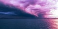 Magenta colored Arcus cloud, sunset seascape. Royalty Free Stock Photo