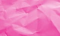 magenta colored crumpled paper texture background for design, decorative