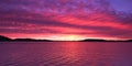 Magenta coloured altostratus cloudy Sunrise Seascape Panorama