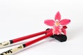 Magenta orchid and chopsticks Royalty Free Stock Photo