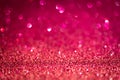 Magenta shiny glitter texture. Selective focus. Glowing surface, sparkle lights and bokeh effects. Christmas and festive Royalty Free Stock Photo