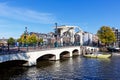 Magere Brug bridge over Amstel Canal and traditional Dutch houses in Amsterdam, Netherlands