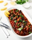 Maghmour or Lebanese moussaka. Dish made from baked or fried eggplant with spices, chickpeas and tomato sauce. Eggplants