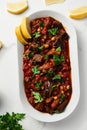 Maghmour or Lebanese moussaka. Dish made from baked or fried eggplant with spices, chickpeas and tomato sauce. Eggplants