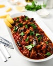 Maghmour or Lebanese moussaka. Dish made from baked or fried eggplant with spices, chickpeas and tomato sauce. Eggplants Royalty Free Stock Photo
