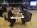 Maghsoodloo Parham and Navara David analyzing position from their game on GM tournament Belgrade 2022 Royalty Free Stock Photo