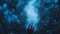 Magic In The Air Hand Releases Sparkling Blue Dust Particles, Creating Dreamlike Bokeh Effect Royalty Free Stock Photo