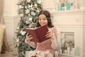Magic atmosphere. Christmas spirit. Little reader enjoy reading at home. Best Christmas book. Books shop commercial