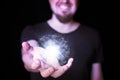 Magic ball in bearded wizard hand Royalty Free Stock Photo