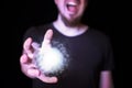 Magic ball in bearded wizard hand Royalty Free Stock Photo