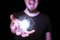 Magic ball in bearded wizard hand Royalty Free Stock Photo
