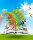 Magic book with a green tree and diferent animals Royalty Free Stock Photo