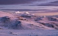 Magic breathtaking purple-pink sunrise sky over the Kilimanjaro volcano crater. 5895m high mount - the highest point of Africa and