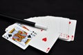 Playing cards and magic wand Royalty Free Stock Photo