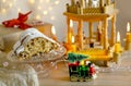 magic of Christmas with Christmas tree on train, Christmas wooden carousel with candles, German Christmas bread-shaped cake
