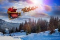 Magic Christmas eve. Santa with reindeers flying in sky Royalty Free Stock Photo