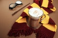 Magic composition with a cup of cocoa, a magic wand, a scarf on