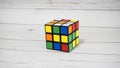 Magic Cube, Rubik`s Cube, on wooden table background. 3D combination puzzle. Royalty Free Stock Photo