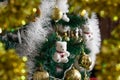 Magic cute Christmas toys and decorations on an artificial Christmas tree, beautiful holiday mood